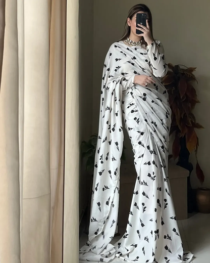 Sareesmadeforthemodernmuse_becausetimelessbeautynevergoesoutofstyle.Checkouthowthestunningby.aleezaisflauntingourlightweightandportablesaree_..._saree_sareelove_bloggerst (1) Women’s Easy-Drape White Georgette Saree with Black Floral Print - Image 1